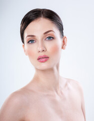 Fototapeta premium Beautiful face of young adult woman with clean fresh skin. Perfect skin Cosmetology, beauty and spa .