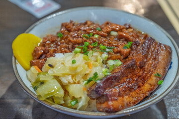 Taiwanese braised pork rice with large chunks of char siu pork