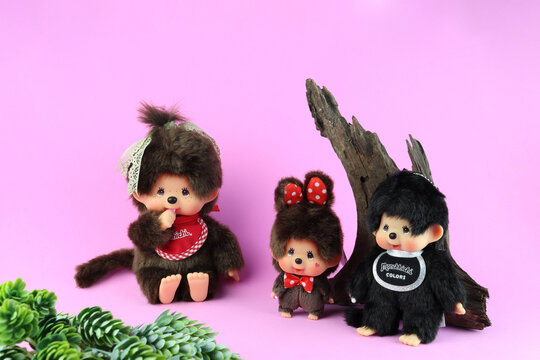 Tokyo Japan 11 October 2025, popular classic plush doll toy , Monchichi or Monchhichi , Japanese cute black monkey fur doll display on pink and purple background in souvenir tourist shop in Japan doll