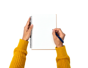 Person writing in lined notebook with pen