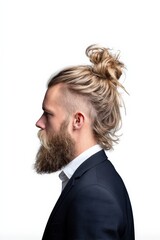 Profile view of a man with stylish hair and beard wearing suit