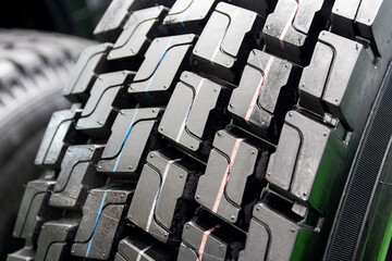 Tires on shelves in a tire shop close-up