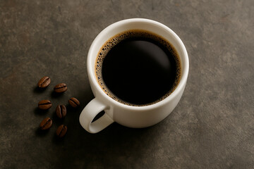 コーヒーカップに入ったコーヒーとコーヒー豆