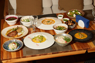 A Diverse Platter of International Cuisine Beautifully Arranged on a Rustic Wooden Table