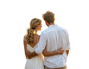 A couple, embracing, watches a sunset. The man's arm rests around the woman, with golden light in the backdrop