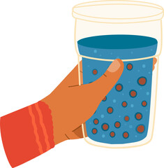 Hand holding glass of bubbly blue beverage