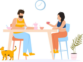 Couple enjoying morning coffee and breakfast with cat