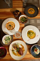 A Delicious Array of Gourmet Dishes Beautifully Presented on an Elegant Table Setting