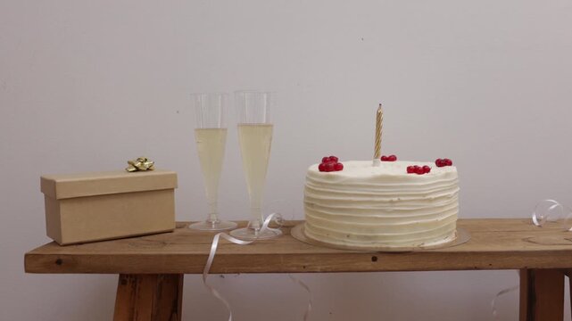 a couple cake with wine and gift