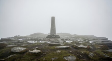 Misty Summit Marker: A Solitary Obelisk Amidst Enigmatic Weather