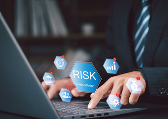 Businessman analyzing developing strategies potential risks,  to reduce damage, assessing finances, and implementing enterprise risk management for business protection.