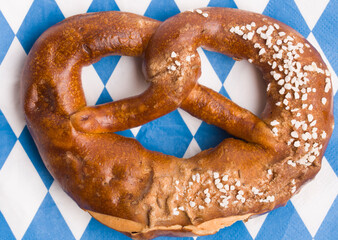 German pretzel against a background of traditional oilcloth colors