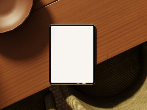 Modern tablet mockup on wooden table with ambient lighting.
