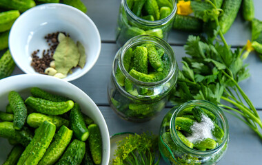 Preserving cucumbers in jars. Selective focus.