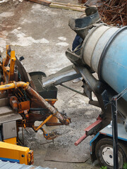 Concrete Pouring from Mixer Truck into Pump Hopper 