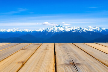 Scenic Mountain View: Wooden Deck Overlooking Snow-Capped Peaks Under a Clear Blue Sky - Landscape Photography, Nature Background