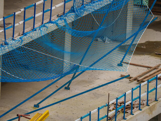 Multi-Story Concrete Building Under Construction with Safety Railings