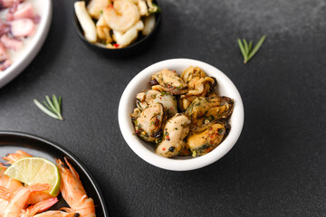 Mussels in white bowl with herbs for seafood menu or healthy lifestyle concept