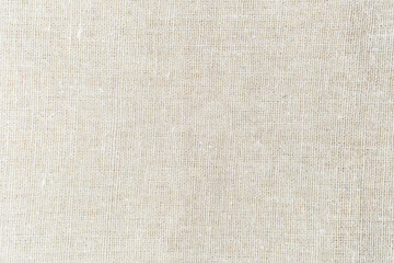 Beige linen fabric texture background close up