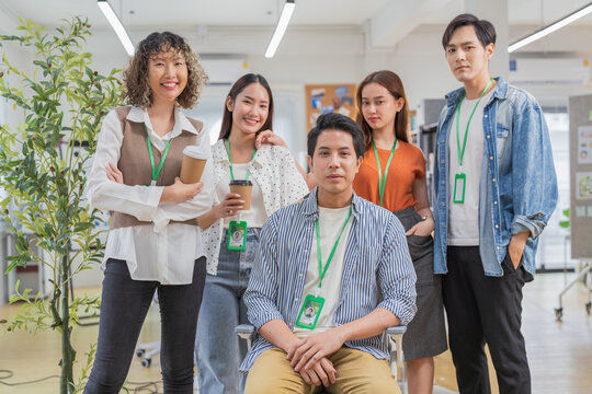 diverse inclusive team stands confidently together in a sustainable workplace symbolizing unity, equality, and purpose. Their collaboration reflects a forward-thinking business culture that values 