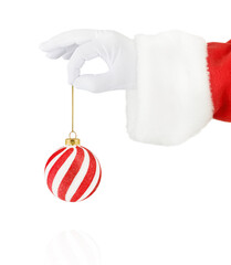 Christmas Santa Claus hand holding Christmas ornament red and white for Christmas tree isolated on white background with clipping path. Design element.