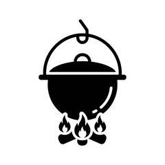 Black Solid Icon of Camping Pot Hanging Over Stylized Flames