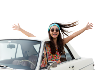 Joyful woman arms outstretched driving classic car