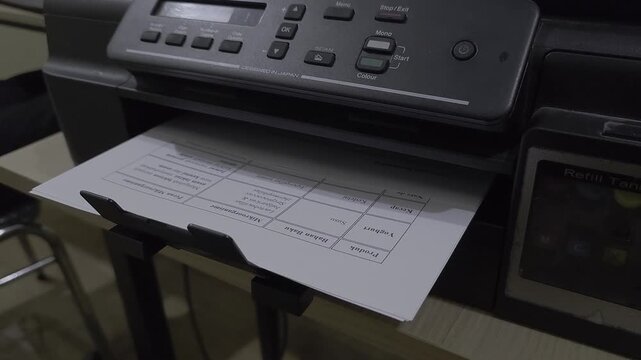 Professional printer outputs detailed scientific research document with charts and data, capturing the moment of information dissemination and knowledge transfer in a modern office setting.