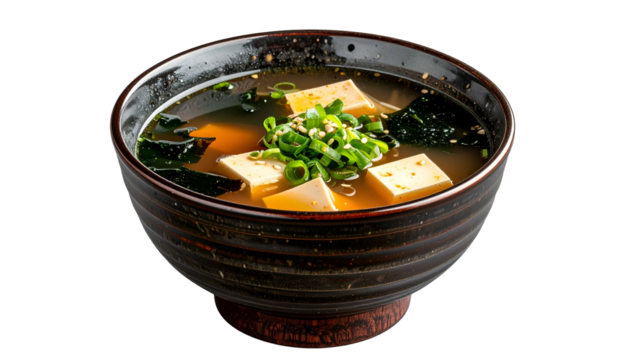Miso soup tofu cubes, seaweed, green onion in dark brown bowl - Powered by Adobe