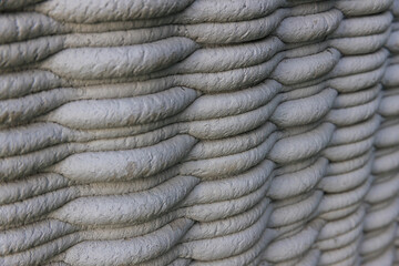 3D Printed concrete texture. architectural background. modern construction of 3D houses. printed house using a 3D printer