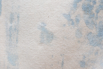藍染液でムラができたアートな柄のキャンバス生地背景素材