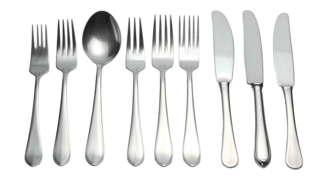 Silverware line-up forks, a spoon, and knives on black backdrop