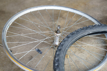 Repairing bicycle dreams a tangled web of spokes on a warm Summer afternoon in the garage