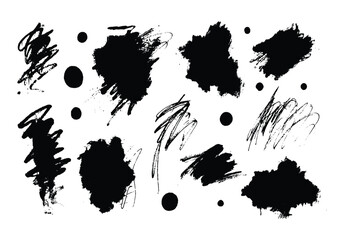 Collection of black ink brush strokes and circular dots on white background splatter