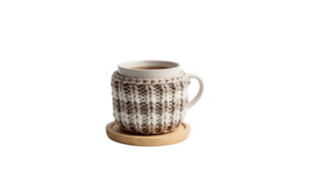 A warm mug of tea in a handmade knitted cozy on a wooden coaster. Cozy winter hygge concept with a hot beverage isolated on a transparent background