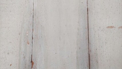 Chipped and peeling white paint on aged wooden board. White painted rustic wood texture background. Exfoliated bright wooden surface with vintage grunge style.