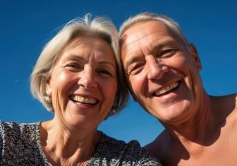 Happy senior caucasian woman and man couple smiling for a joyful selfie. Retirement and active senior lifestyle concept for travel or vacation.