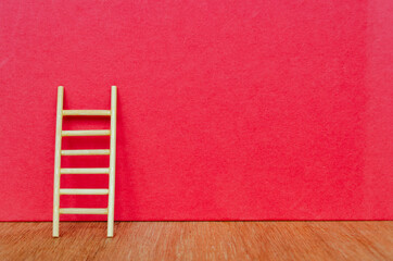 Ladder with red background with customizable space for text.
