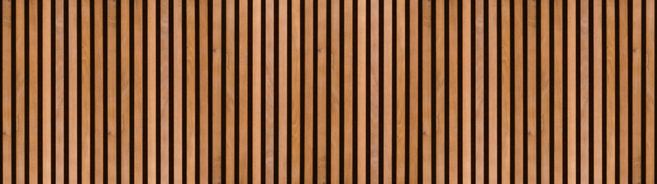 Wood background banner panorama long - Brown wooden acoustic panels wall texture , seamless pattern, vertical