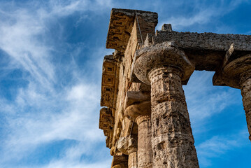 view of greek ancient ruins forum in Peastum, salerno with a blue sky in background