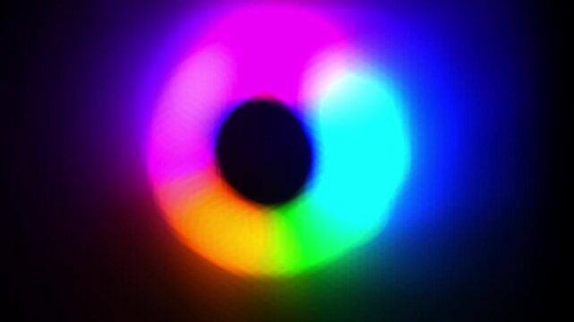 Close-up footage of colorful RGB computer fan lights glowing in the dark, creating a vibrant abstract background of modern technology