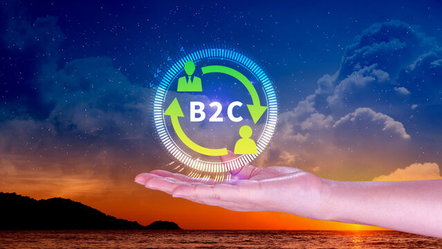 B2C, Business to customer marketing strategy concept. Businessman holding with virtual B2C icon for business strategy, communication, feedback, online marketing, Ecommerce marketing strategy.