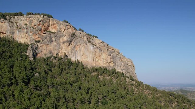 Mallorca landscape: Alaro town nestled in a green valley with rolling hills and distant plain