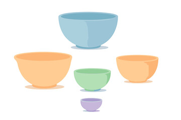 Assortment of pastel colored kitchen mixing bowls in various sizes for cooking and baking