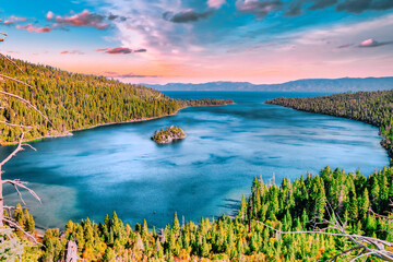 Emerald Bay Lake Tahoe California USA panoramic view of blue lake water surrounded by green pine forest and Sierra Nevada mountains under clear sky popular travel and nature destination