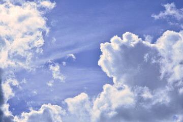 A beautiful sunny bright heaven cloudscape with a clear blue sky and clean clouds