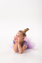 Girl with cochlear implant lying and smiling to the side. Hearing recovery, childhood confidence,...
