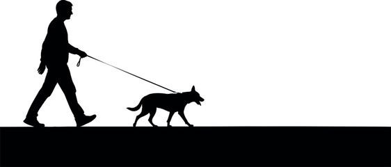 Silhouette of a man walking his dog on a leash.