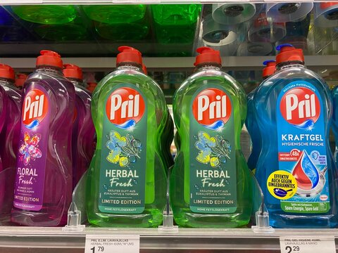 Palma, Spain - October 16, 2025: Pril dishwashing liquid bottles in vibrant colors displayed on supermarket shelf, showcasing limited edition herbal and floral scents for effective cleaning