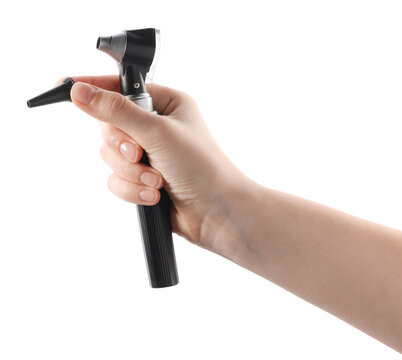 Hearing test. Woman with otoscope and ear speculum on white background, closeup
